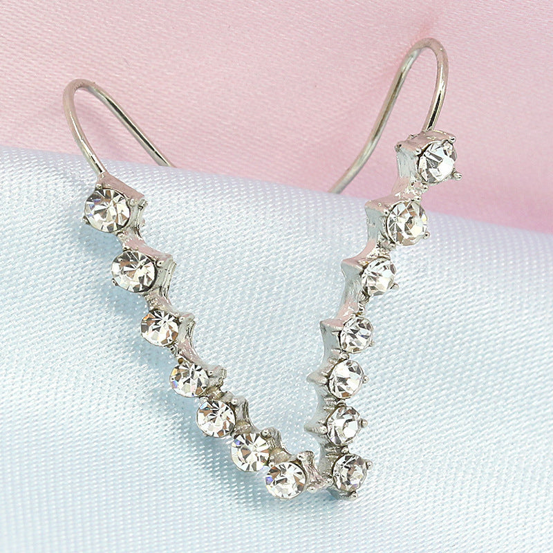 Orecchino con sette stelle e diamanti