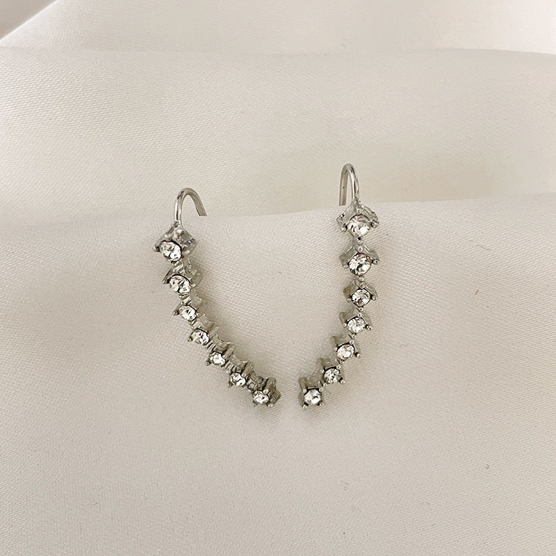 Orecchino con sette stelle e diamanti