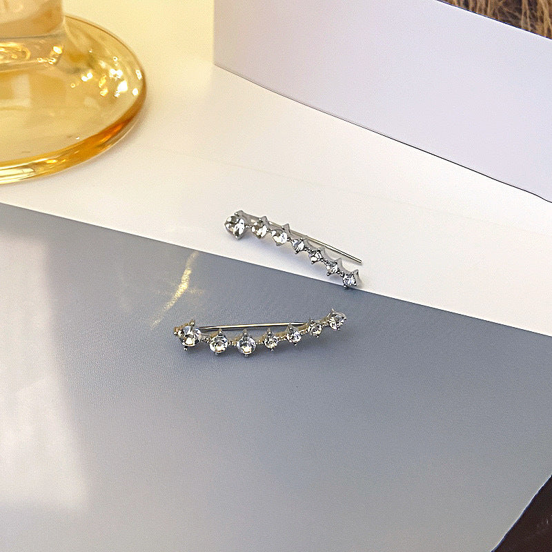 Orecchino con sette stelle e diamanti
