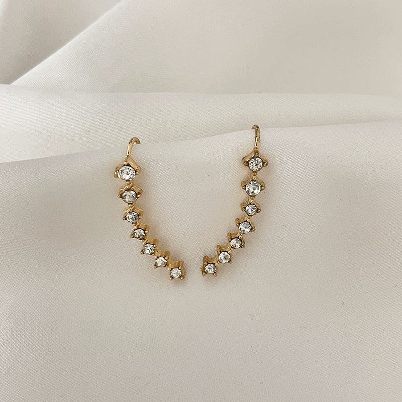 Orecchino con sette stelle e diamanti