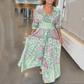 Abito lungo elegante con stampa floreale e cordoncino da donna