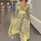 Abito lungo elegante con stampa floreale e cordoncino da donna