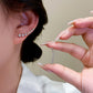 Orecchino con sette stelle e diamanti