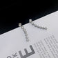 Orecchino con sette stelle e diamanti